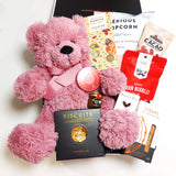 Baby love gift basket with pink teddy, honey, popcorn, biscuits & nibbles. Presented in a modern gift box.