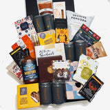 Beer Bonanza Gift hamper for the beer enthusiast filled with 6 craft beers and a large assortment of chocolate, chips, pocorn and snacks best enjoyed with beer. Presented in a modern gift box.