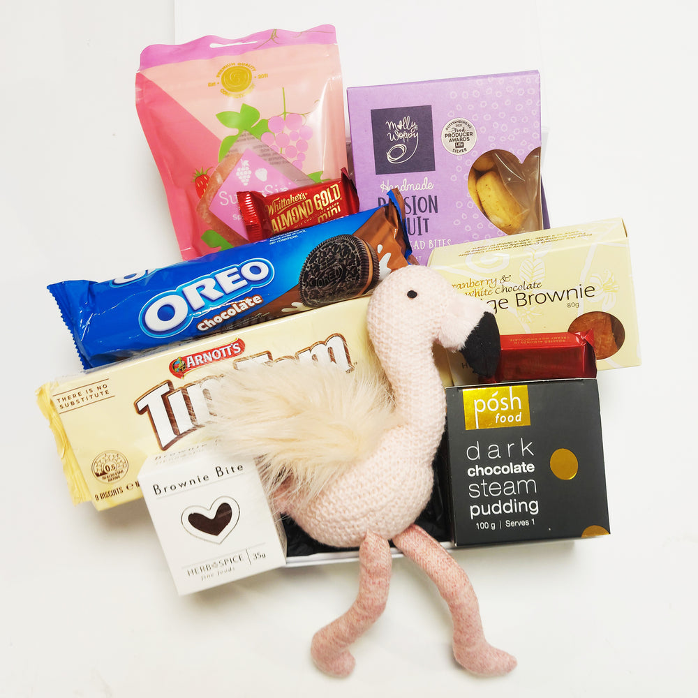 New baby Girl Gift Hamper with pink flamingo rattle, tim tams, passionfruit shortbread & more. Presented in a modern goft box.