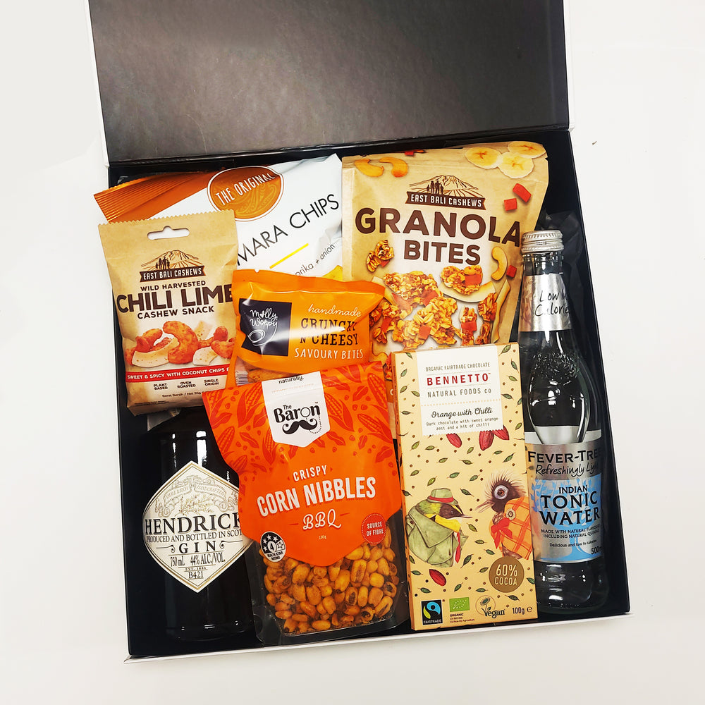 Gin for the win gift basket with Hendricks gin, fever tree tonic, chocolate, chips and nibbles. Presented in a modern gift box.