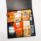 Gin for the win gift basket with Tanqueray gin, fever tree tonic, chocolate, chips and nibbles. Presented in a modern gift box.