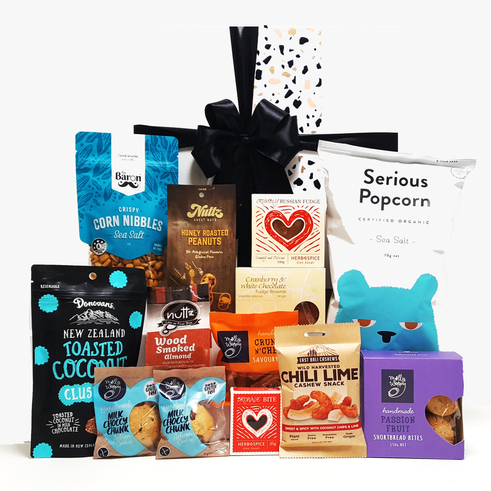Guilty Pleasures gift basket with sweet and savoury treats all presented in a modern gift box.
