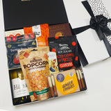 Happy Hour Gift Basket with wine, biscuits, chocolate, fudge and nibbles presented in a modern gift box.