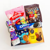 Hop to it Easter gift hamper with chocolate, gingerbread, & bunnies all presented in a modern gift box.