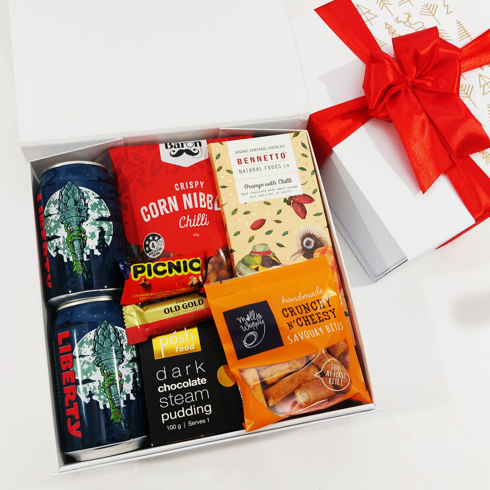 Christmas gift basket for men with beer, nibbles, steam pudding & chocolate all presented in a modern gift box.