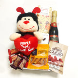 Romantic gift basket with soft toy, fudge, brownie, & chocolate presented in a modern gift box.