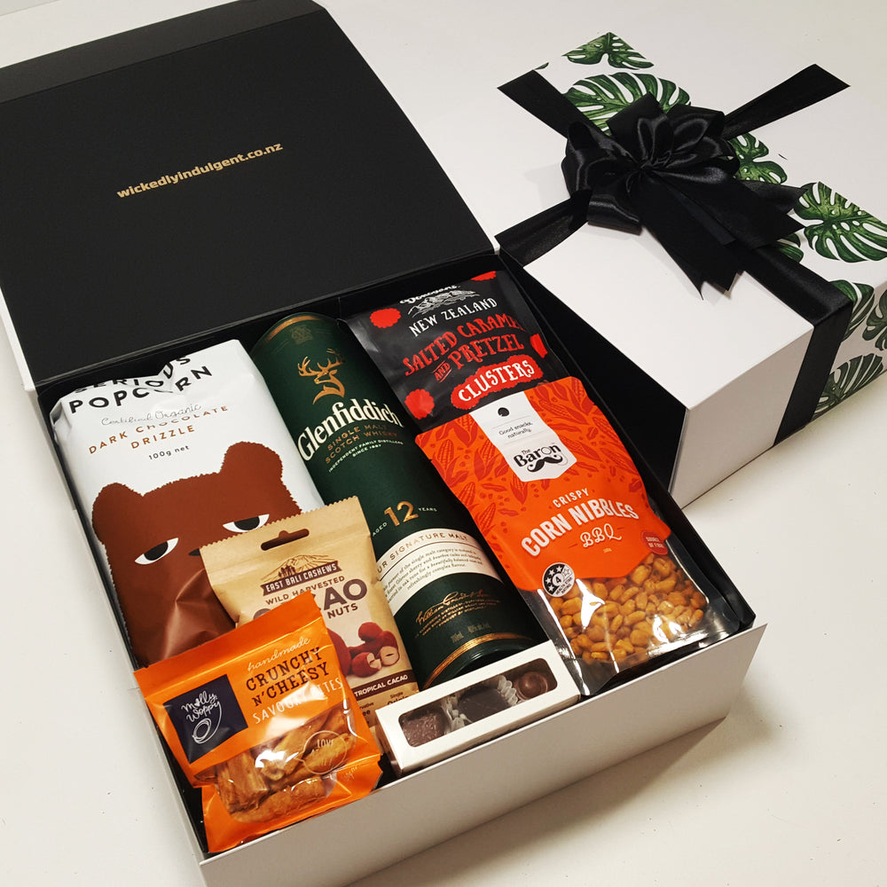 On the Rocks Corporate gift basket with whisky, chocolate, nuts and popcorn all presented in a modern gift box.
