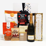Pop. Fizz. Clink gift basket with No.1 Assemble bubbles and sweet & savoury nibbles.