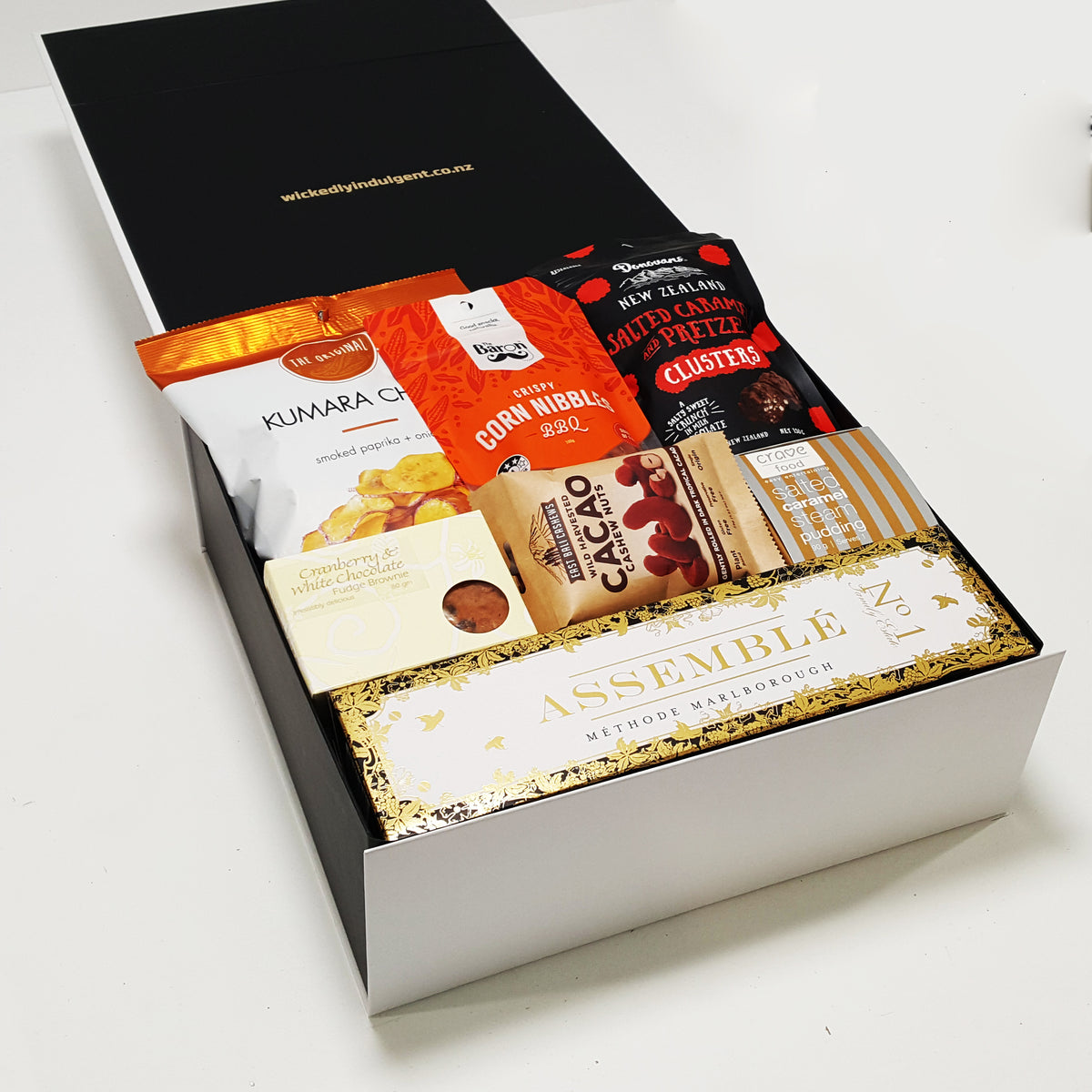 Pop. Fizz. Clink gift basket with No.1 Assemble bubbles and sweet & savoury nibbles.