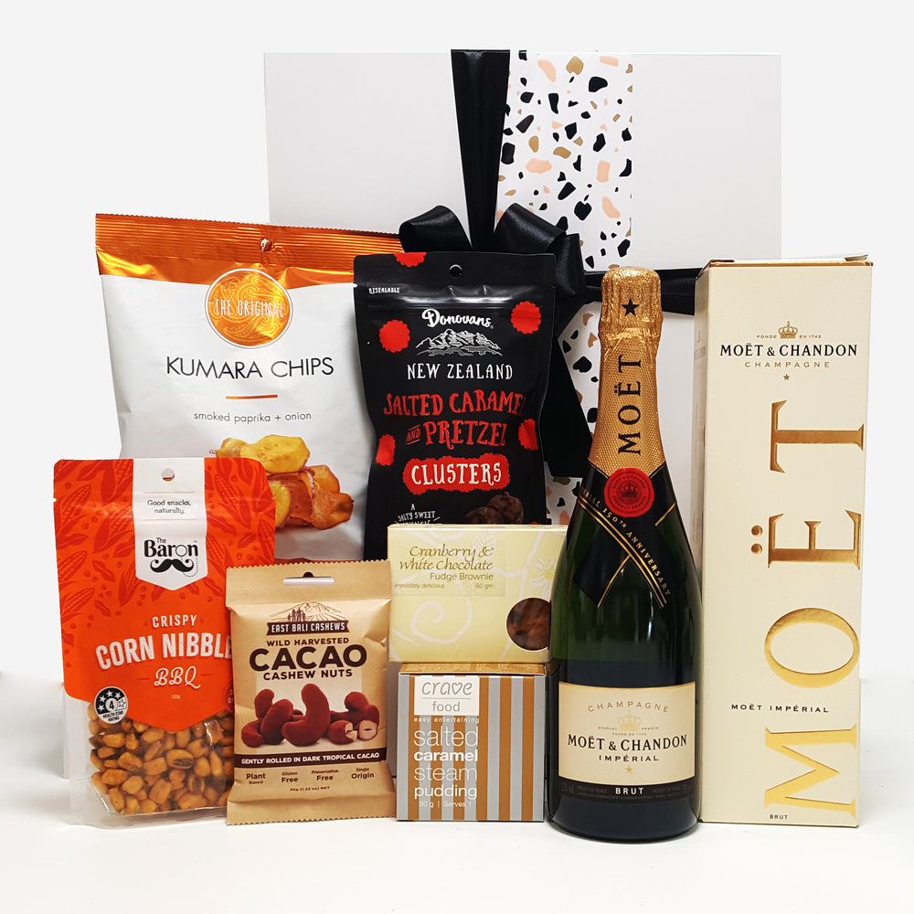 Pop. Fizz. Clink gift basket with Moet Champagne and sweet & savoury nibbles.