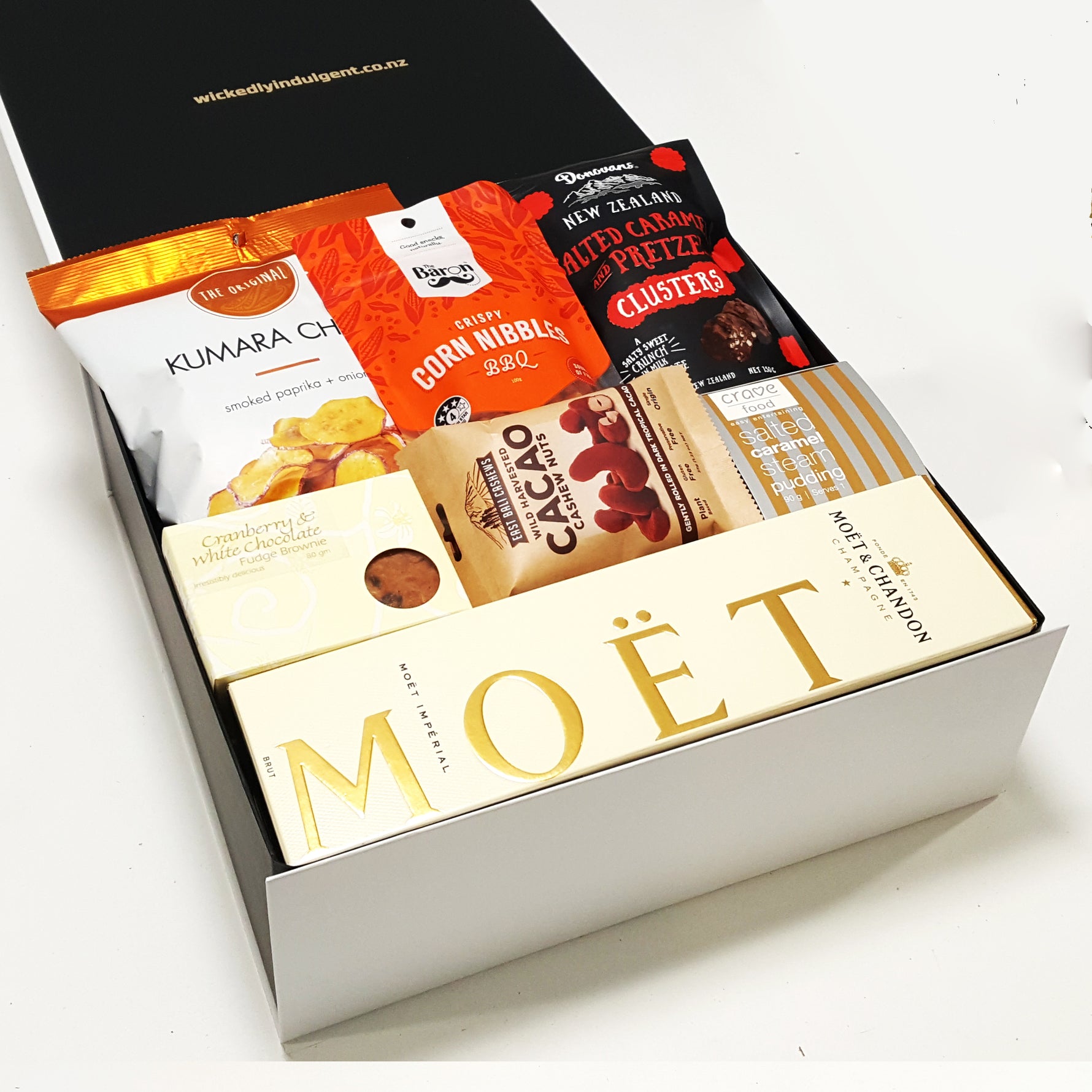 Pop. Fizz. Clink gift basket with Moet Champagne and sweet & savoury nibbles.