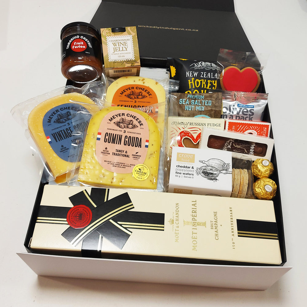 Simply the Best Champagne gift basket with Cheese, Chutney, Chocolate, Olives, Nuts & more all presented in a modern Gift Box.