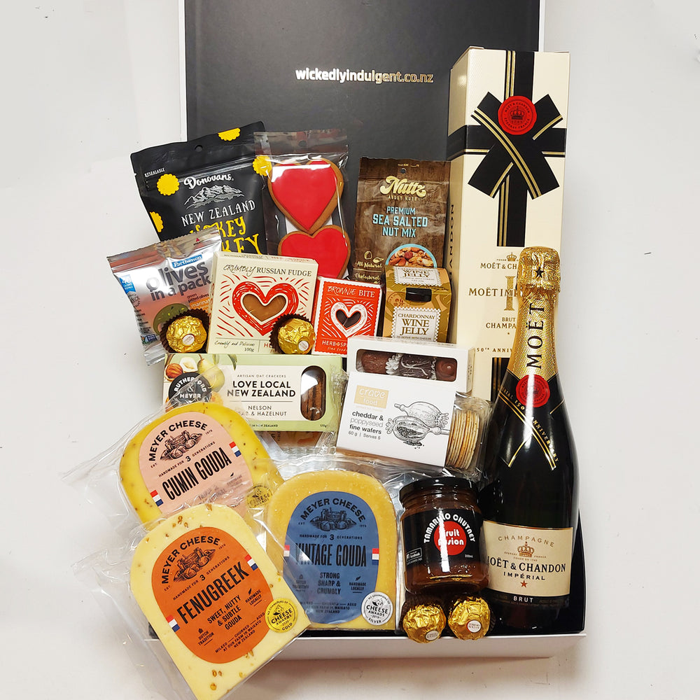 Simply the Best Champagne gift basket with Cheese, Chutney, Chocolate, Olives, Nuts & more all presented in a modern Gift Box.