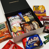 Snack Attack gift basket with M&M's, MallowPuffs, Maltesers, Toffee Pops & More presented in a modern gift box.