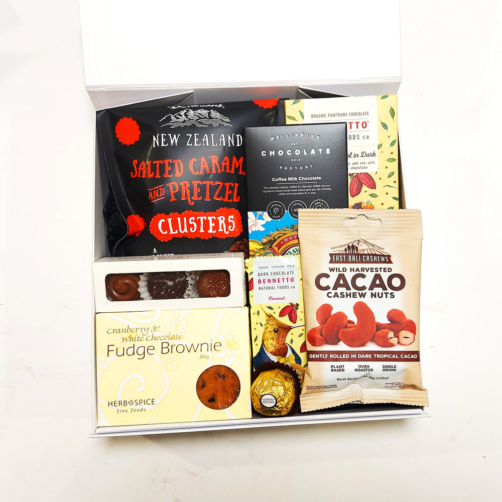 Gift box with all things chocolate perfect for a chocolate lover. Presented in a modern gift box.
