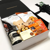 Kraken rum gift hamper with kumara chips, popcorn, nuts, brownie and cheesy bites all presentde in a modern gift box.