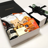 Kraken rum gift hamper with kumara chips, popcorn, nuts, brownie and cheesy bites all presentde in a modern gift box.
