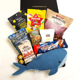 Underwater snacker gift basket with Lily & George Whale Soft Toy, Beef Jerky, Nuts, Biscuits & Nibbles. Presented in a modern Gift Box.